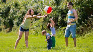 A family playing ball on the garden